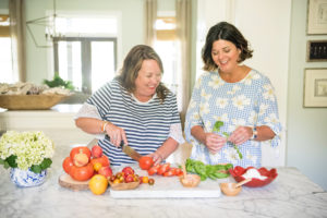 The Southern Coterie co-founders Cheri Leavy and Whitney Long sharing their recipe for Summer Tomato and Peach Salad on the Draper James blog (photo: Kelli Boyd Photography)